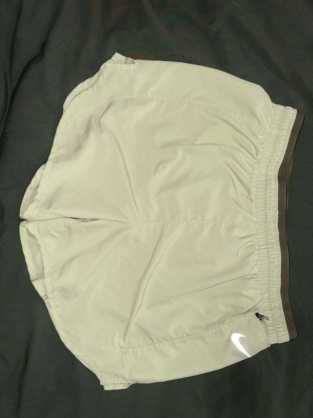 Light green Nike running shorts